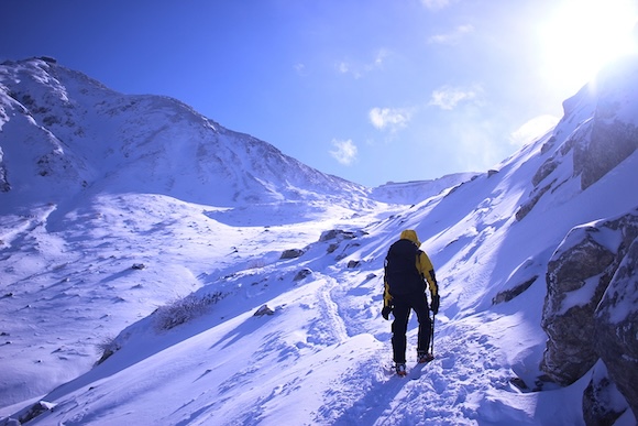 climbing mountain in winter